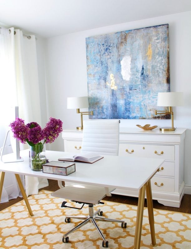 white home office with white and gold rug