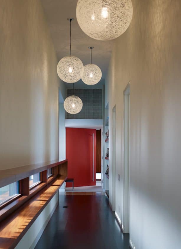 bright red painted wide door for a modern hallway