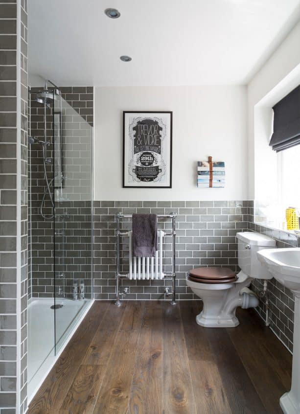 traditional bathroom with grey subway ceramic tile wall and engineered oak floor