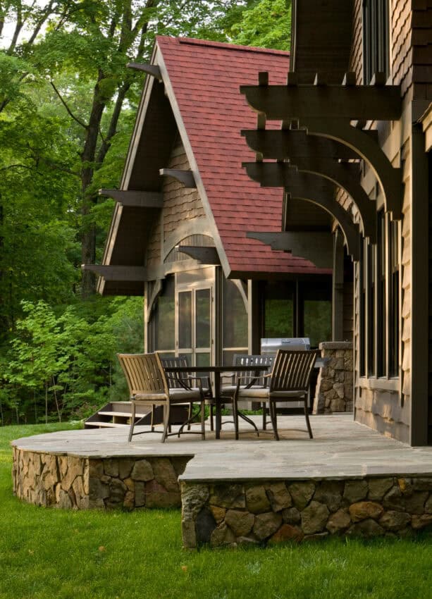 stone raised patio made of chief river veneer and bluestone deck