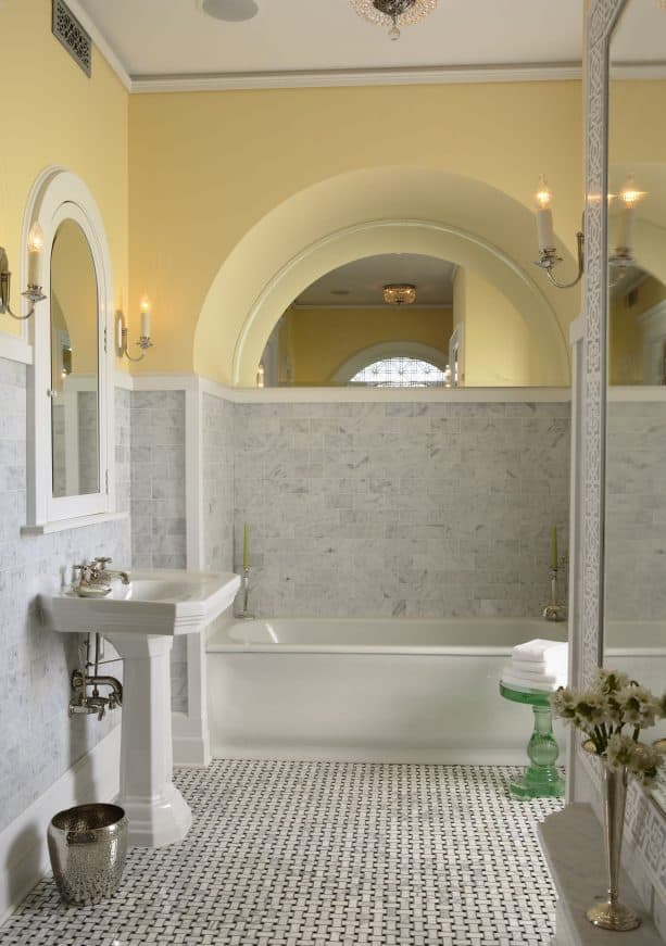 a traditional bathroom with two-toned wall design