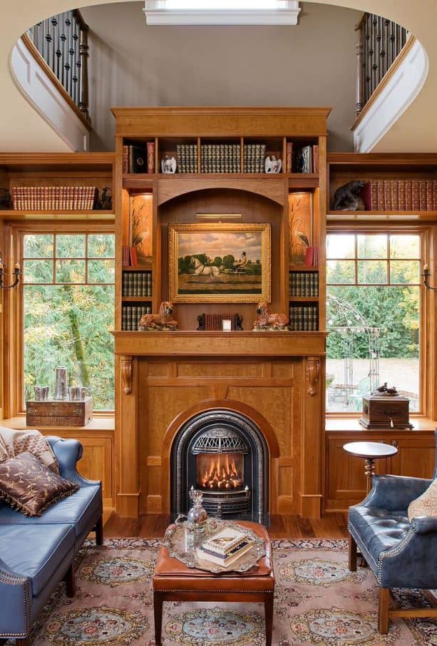 victorian medium tone wood fireplace with built-in shelves and cabinets