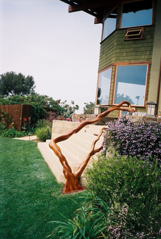 the end of the railing makes it looks like it grows directly from the ground