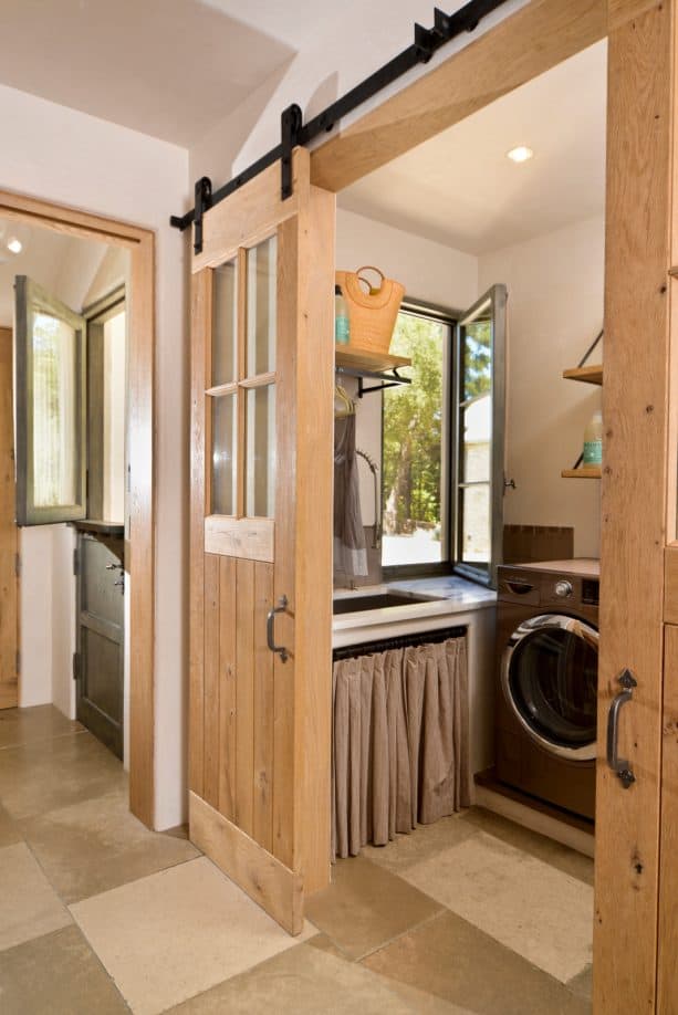 light tone wood barn doors with traditional windows style