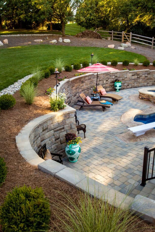 stone retaining wall around a step-down patio