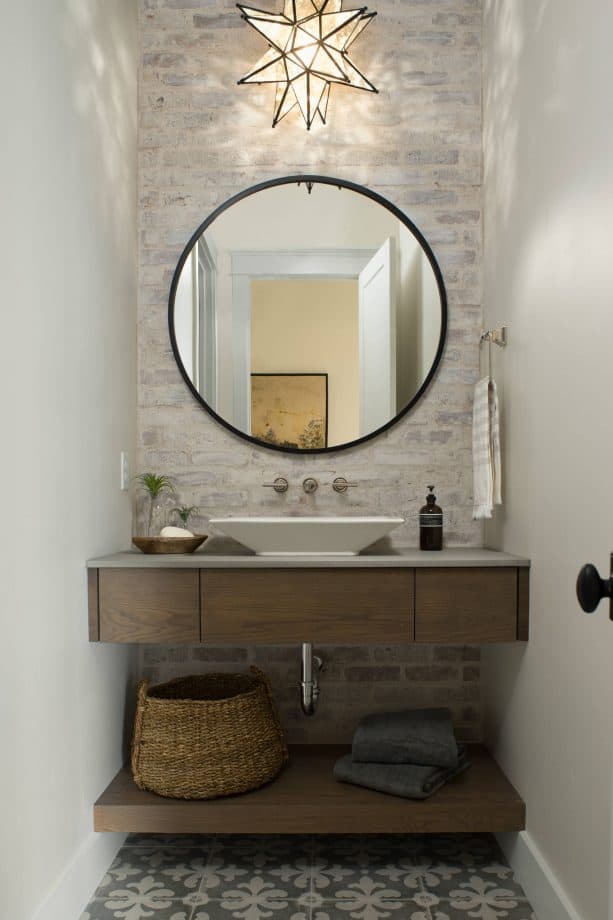 after photo of a powder room with german smear brick wall