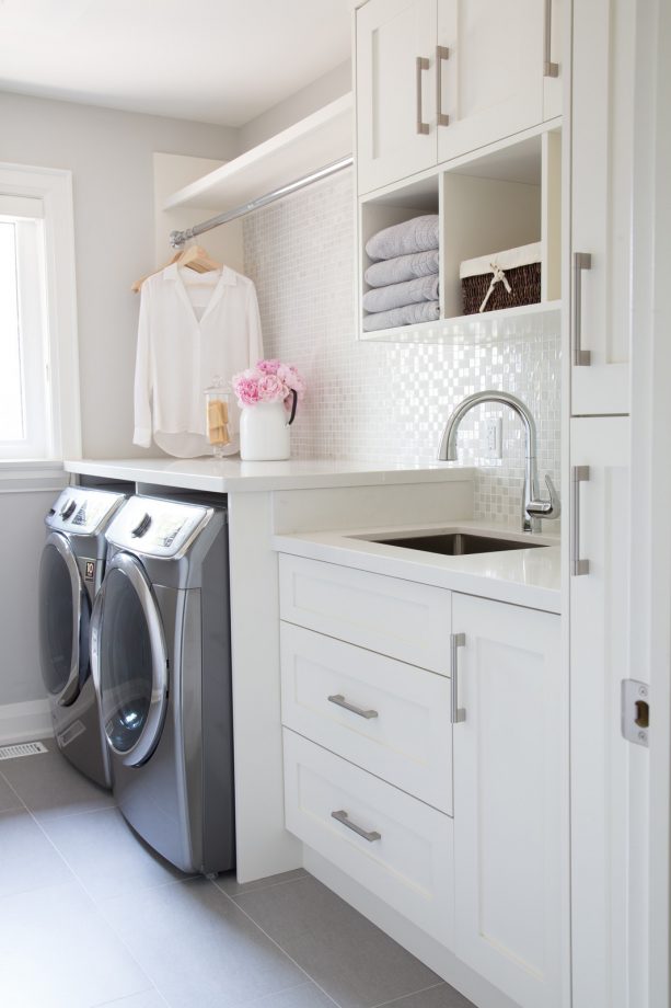 small laundry room with white color domination