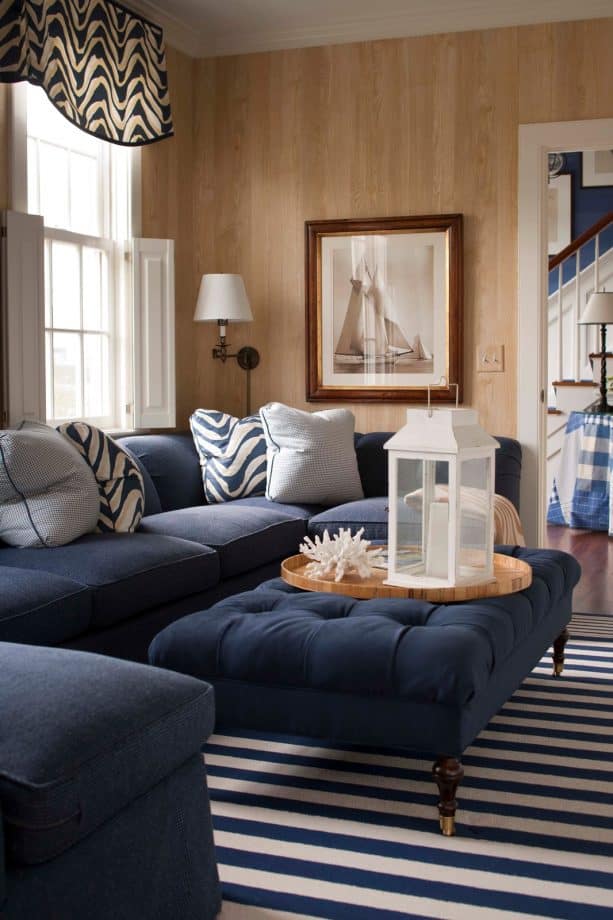 navy blue sectional couch with light grey pillows