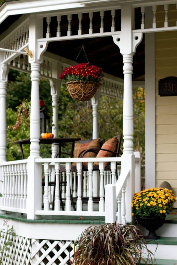 Victorian porch with white turned baluster railing