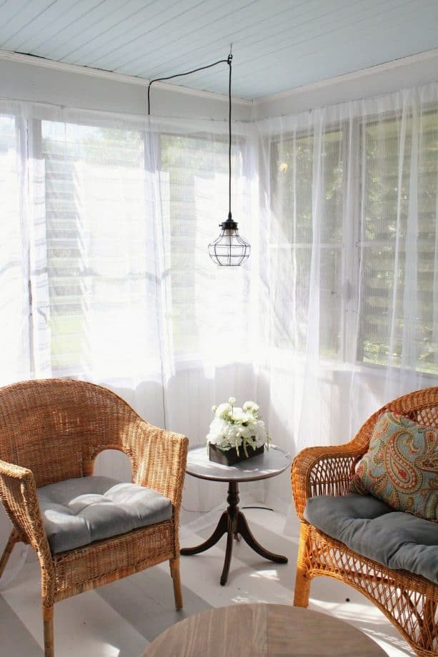 a living room with ceiling pendant with plug