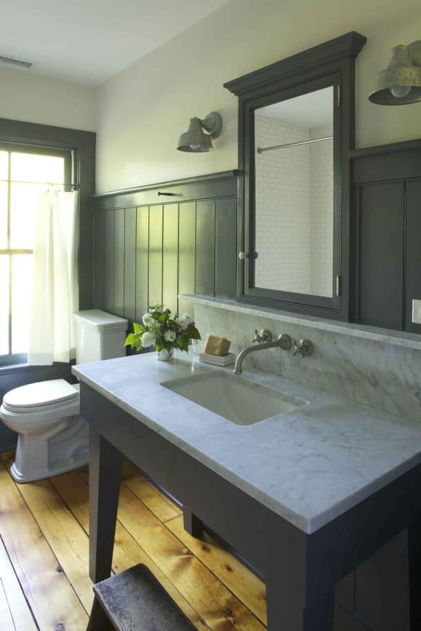 bathroom with grey beadboard walls and heart pine wood floor with clear finish