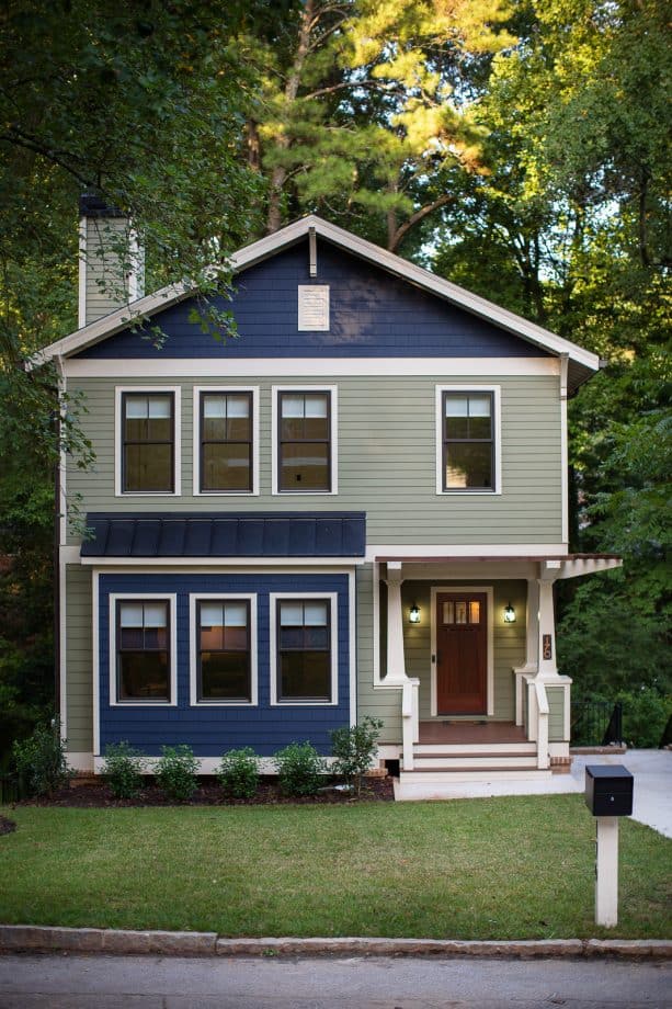 a unique exterior design with sage green and navy color combination