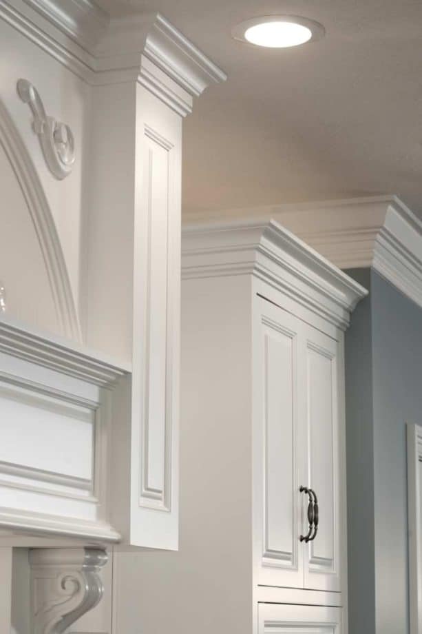 crown molding as a cabinet trim with an upside down baseboard below