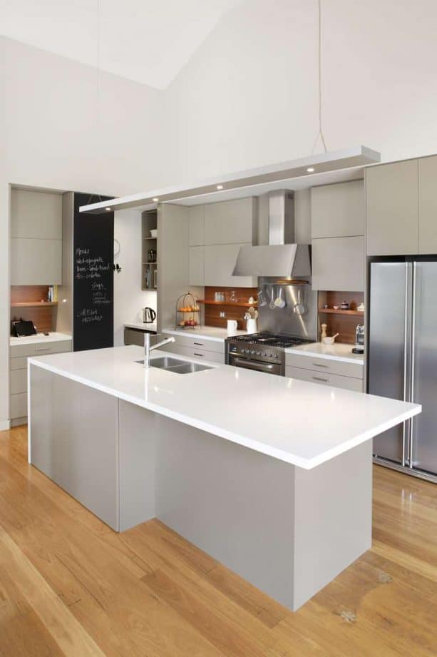 clean grey kitchen with medium tone wood for the backsplash