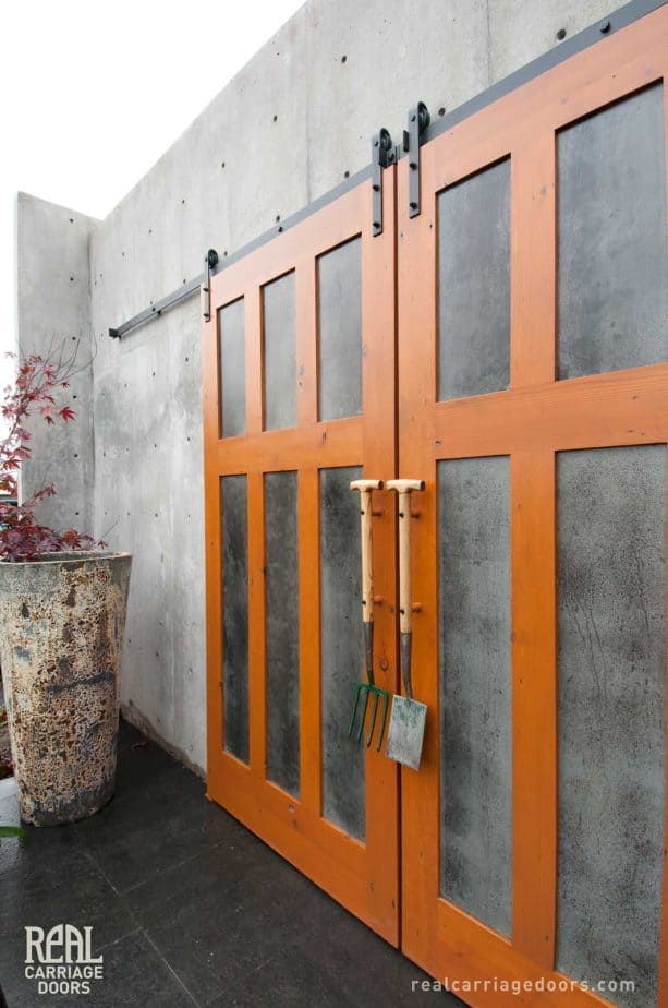 sliding barn doors are born from the combination of galvanneal metal panels and fir