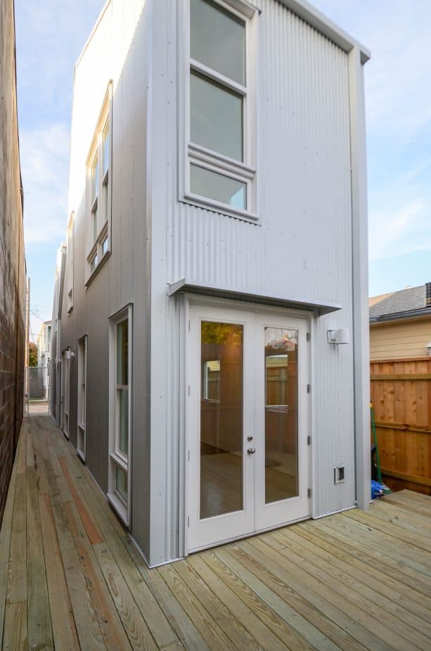 vertical slide windows in a slim metal building