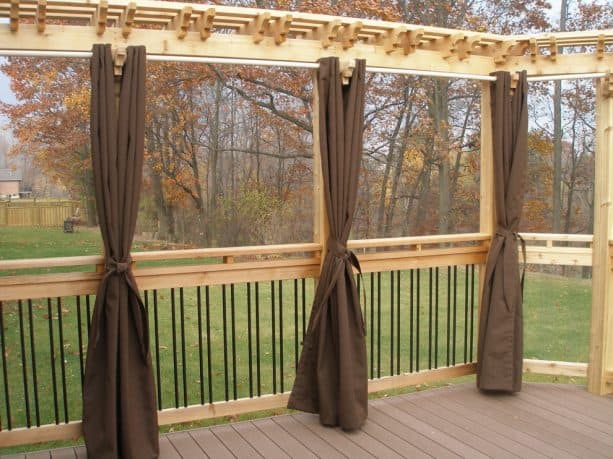 privacy screen for deck from a pergola and brown curtain