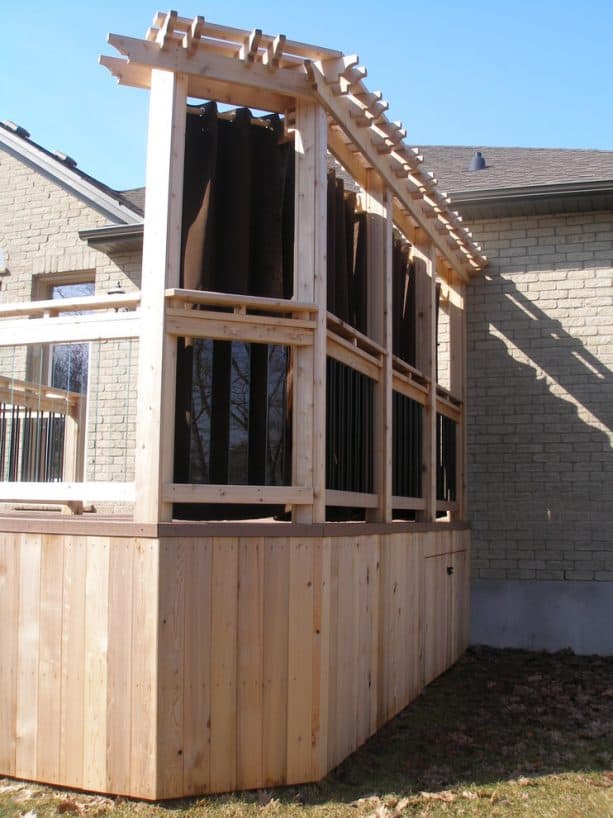 the back view of the pergola and curtains privacy screen