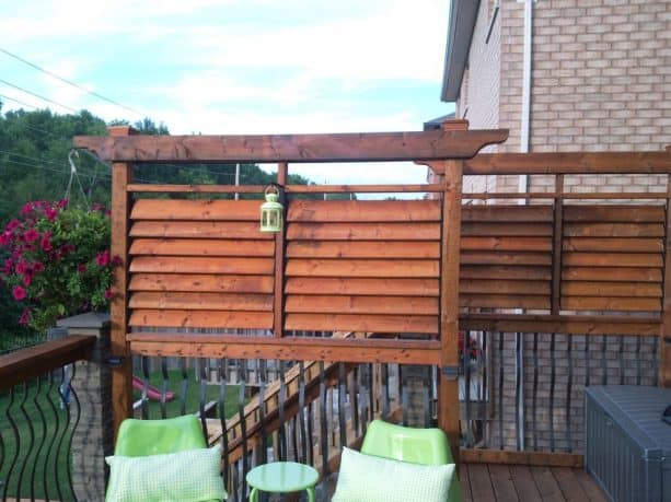 traditional deck with rustic louver screen