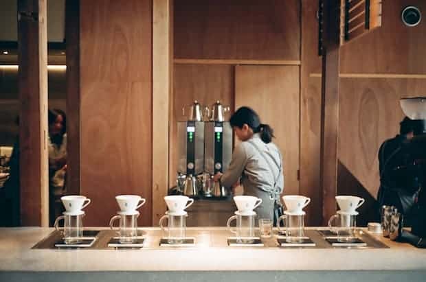 A barista behind the bar at Blue Bottle Coffee in Kyoto, Japan