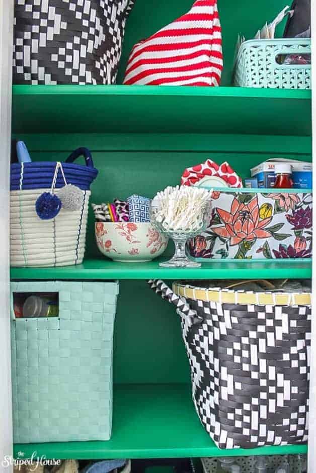 emerald green hall closet makeover with eclectic pretty storage