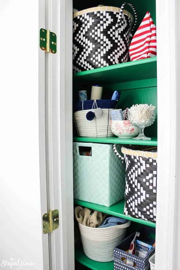 emerald green hall closet makeover with eclectic pretty storage