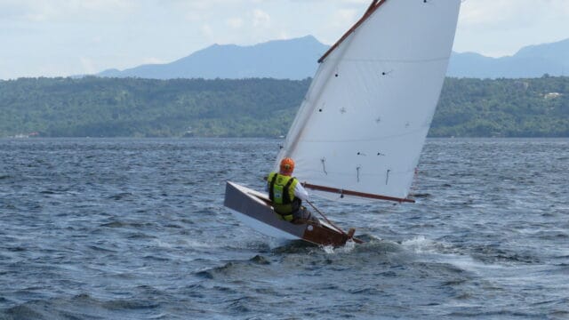 Oz Goose sailing upwind - thom kleiss with his lovely varnished hull