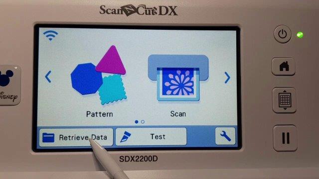 First screen of the Scan N Cut showing the home button and Retrieve Data