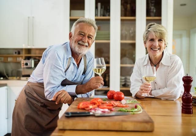 Retired couple cooking together on National Cooking Day