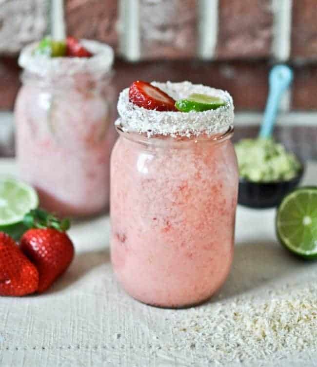 Strawberry Coconut Margarita in a Mason Jar! The Best Margarita Recipes ever! From Strawberry and Blackberry to Pineapple and Coconut, you'll find a frozen cocktail perfect for party drink or a hot summer day! LivingLocurto.com