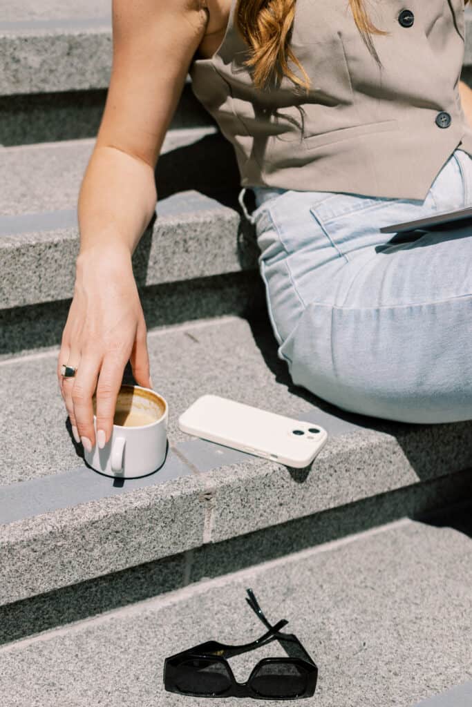 Person sits on steps exploring ways to repurpose their content for social media