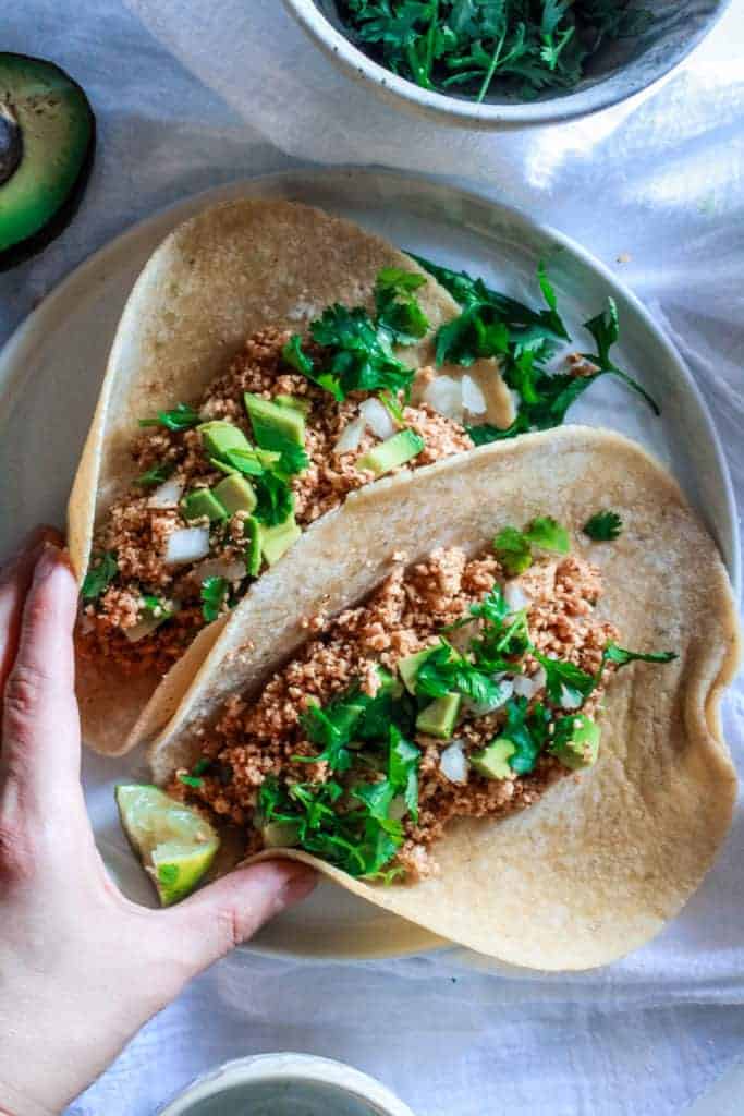 Tasty vegan tacos made with cauliflower as taco meat grilled in a skillet! This taco recipe is delicious and ready in 20 minutes!