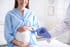 Pregnant woman receiving RSV vaccine, illustrating the maternal RSV vaccination program's impact on cutting newborn ICU admissions in half