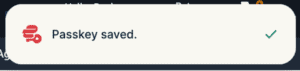 The "Passkey saved." confirmation pop-up from the ExpressKeys browser extension.