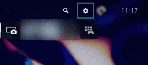 PlayStation console interface showing the top system menu bar, with the gear-shaped "Settings" icon highlighted by a green box.