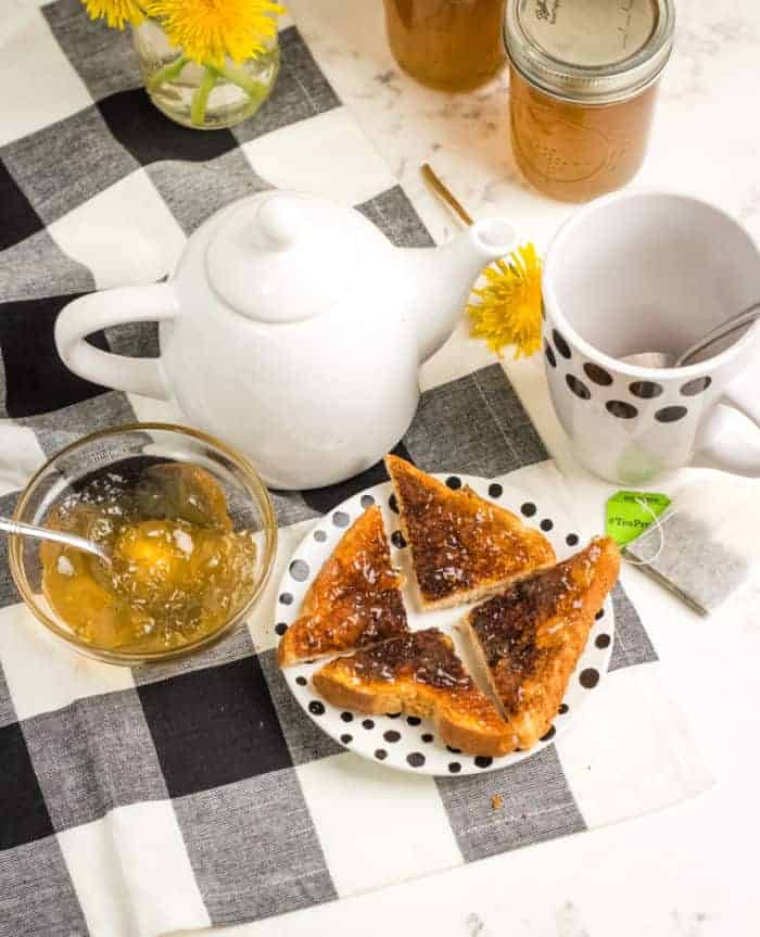 Table set up for breakfast with toast and tea.