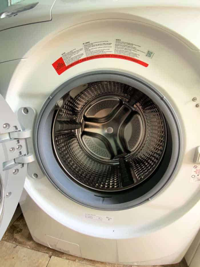 Front loading washing machine with the door open.