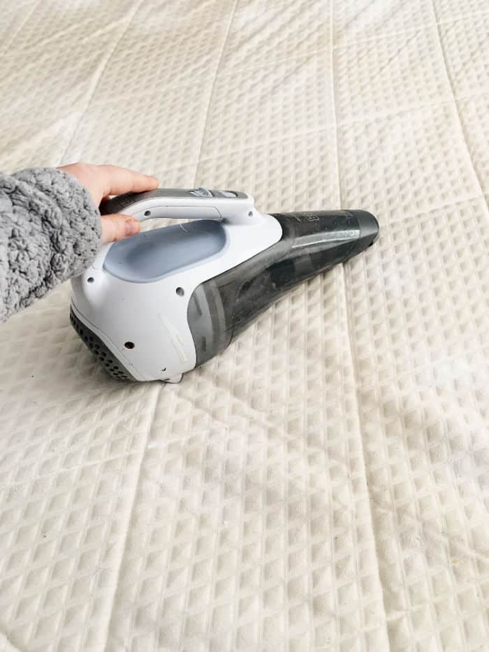 Vacuum the baking soda off the mattress.