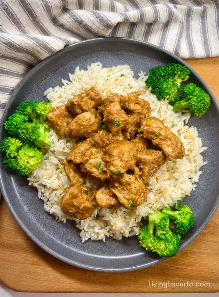 Easy peanut butter chicken recipe with Thai peanut sauce on a plate with rice and vegetables.