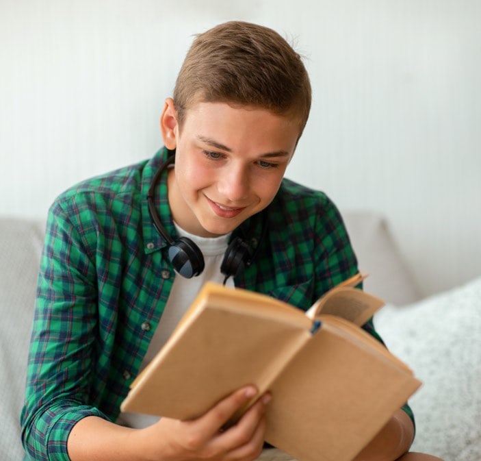 Teen boy reading