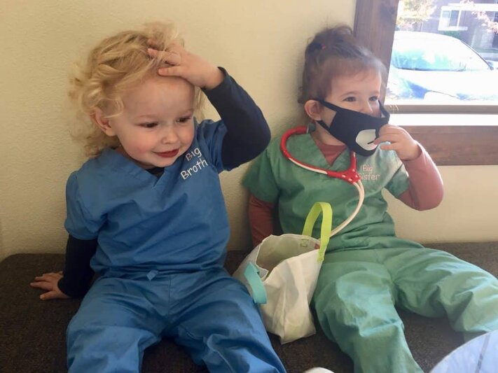 montessori kids using imaginative play to learn about jobs at the hospital