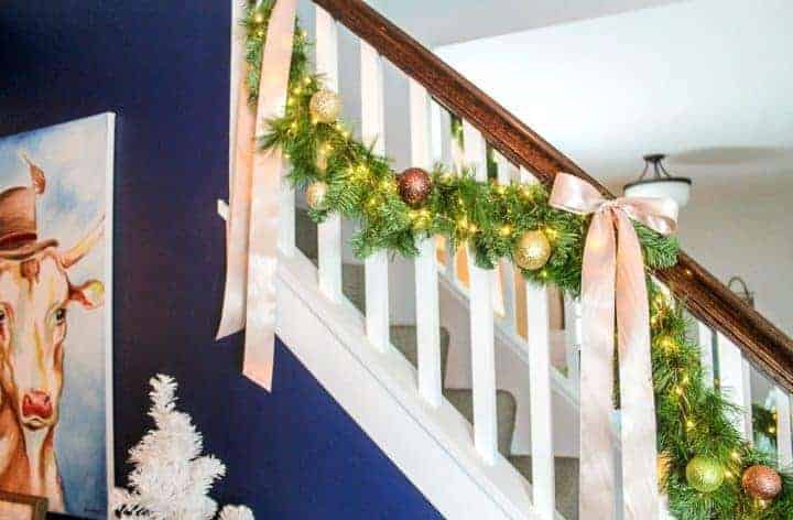 staircase with greenery garland hung from it