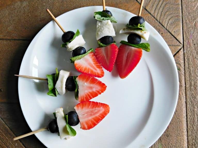 Berry mozza bites laid out on white plate