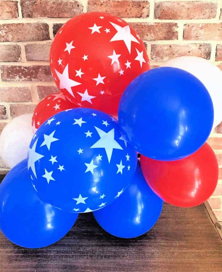 red white and blue balloons in a clump