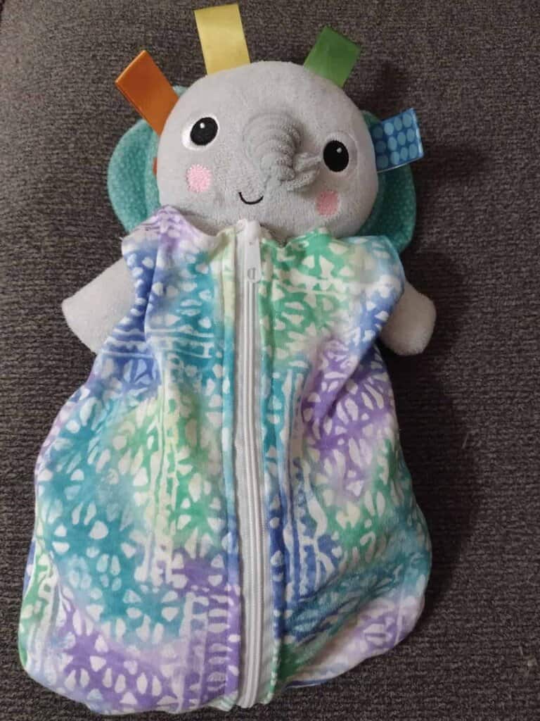 Picture of elephant lovey in a sleep sack