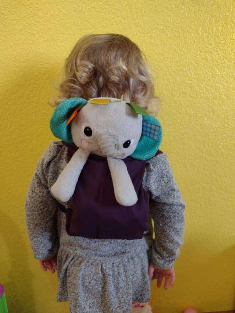 Picture of a toddler with a lovey backpack