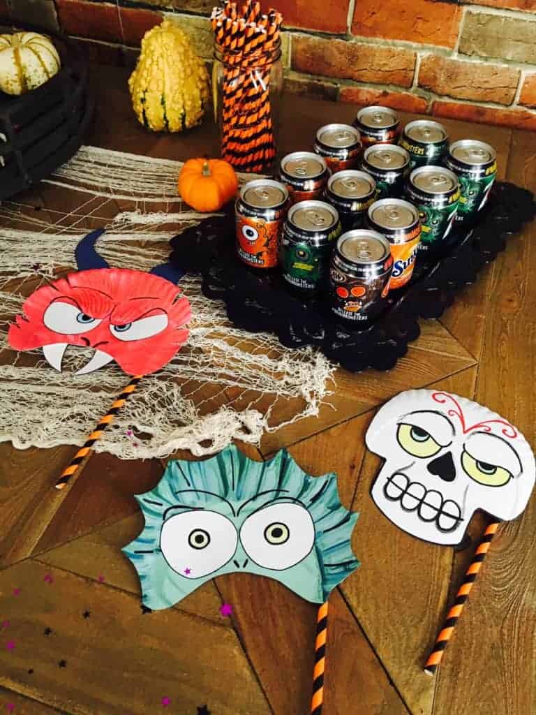 soda and part masks laid out for a party