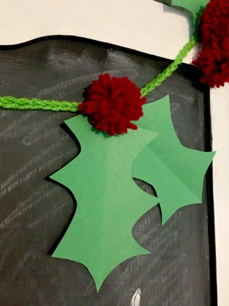 showing off homemade holly