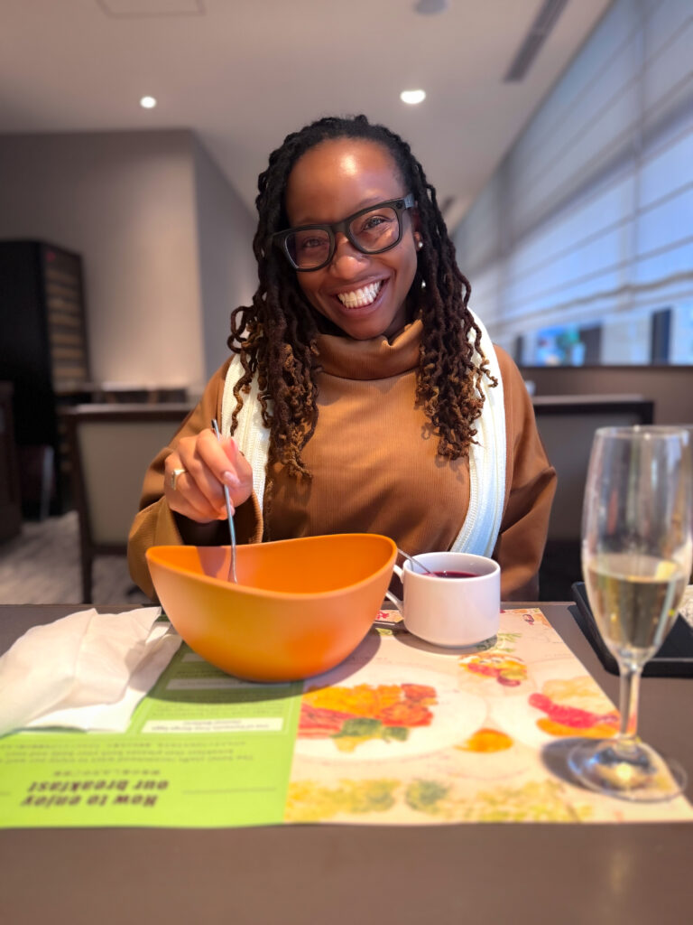 Travel Black Woman having breakfast in Tokyo at Shiba Park Hotel
