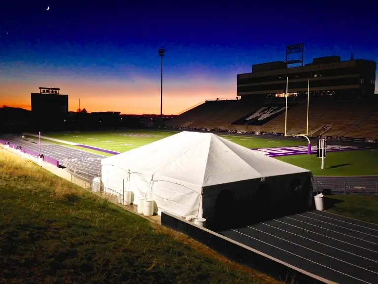 Event rental in Ogden, UT 2 Weber State University Tent at night on the football field